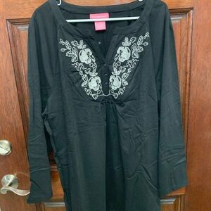 Woman Within Black Tunic with Floral Embroidery